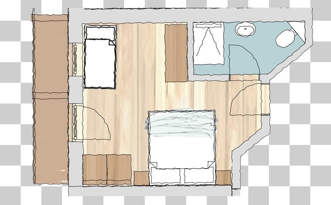 A room with a bed, a desk, a chair, and a window.