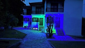 A two-story building with a stone pathway leading to the entrance. - GeoBasement - Mexico (Pefkochori)