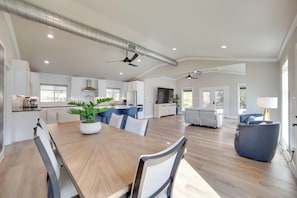 A spacious kitchen with a dining area, built-in cabinets, and a large window. - On-site Dock & Ramp: 3-unit Escape on Lake Fork! (Emory)