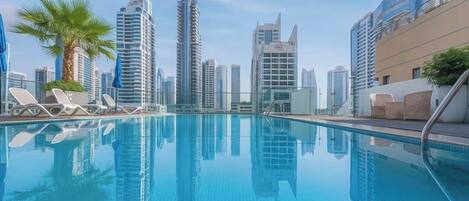 2 outdoor pools, open 8:00 AM to 10:00 PM, pool umbrellas, pool loungers