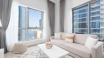 Standard Apartment, 1 Bedroom, Marina View | Living area | 55-inch Smart TV with satellite channels, Netflix, Hulu