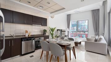 Business Apartment, 1 Bedroom, Canal View | Living area | 55-inch Smart TV with satellite channels, Netflix, Hulu