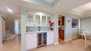 A kitchen with white cabinets, a countertop, and a window. - Significant Golf Views from this 3-Bedroom Fazio Villa (Hilton Head)