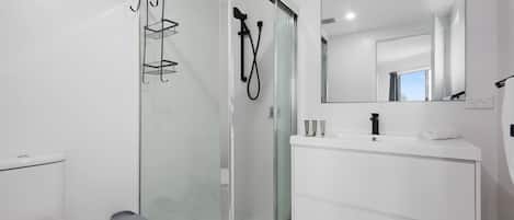 Shower, hair dryer, towels, shampoo