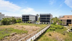 A modern hotel with a flat roof, multiple floors, and a pool area. - 3 Bedroom, 2 Bath Gulf View Condo at Shorewood (Sanibel)