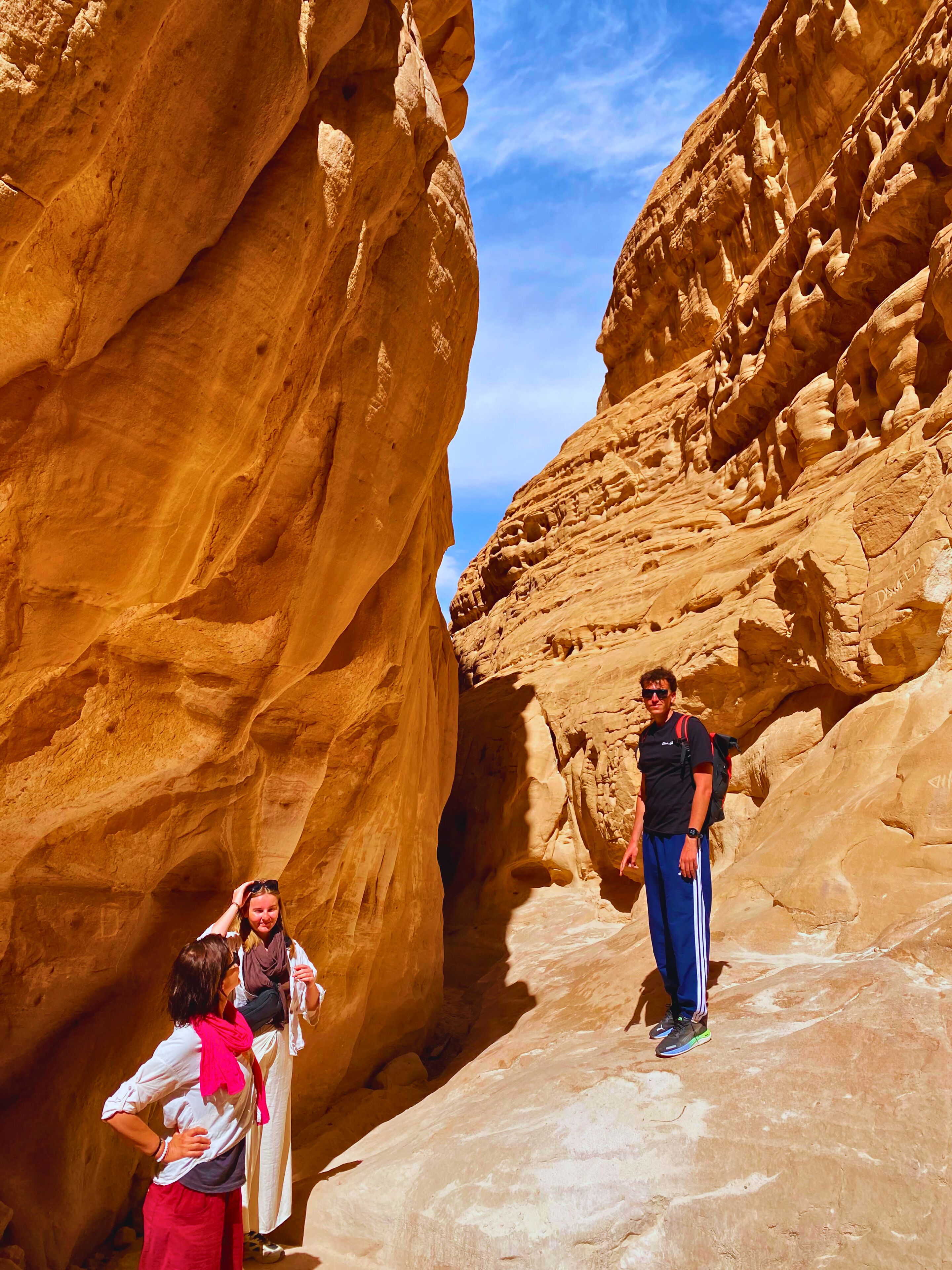 A narrow canyon with large rock formations.