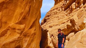 A narrow canyon with large rock formations.