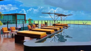 Outdoor pool, open 6:00 AM to 10:00 PM, pool umbrellas, sun loungers