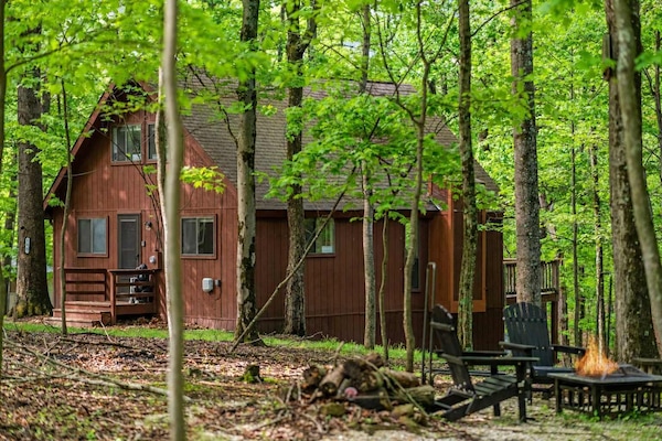 Escape to a cozy Hedgesville cabin retreat surrounded by nature, just minutes from hiking, dining, and local attractions, with access to The Woods Resort amenities.