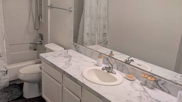 Hair dryer, towels, soap, toilet paper