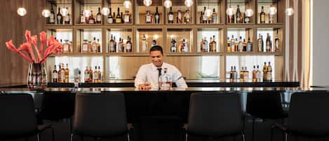 Premium bedding, down duvets, free minibar items, in-room safe
