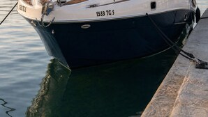 A boat docked at a marina with a clear sky. - Dream boat (Tunis)