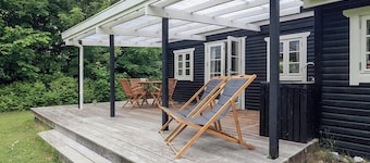 La vie de vacances dans une maison de vacances intime en bois