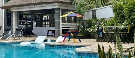 Outdoor pool, pool umbrellas, sun loungers
