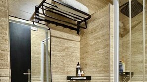 A bathroom with a white sink, toilet, and a glass shower enclosure. - Annavilla7 Lilongwe Hotel (Lilongwe)