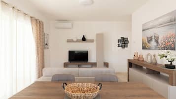 Appartamento Comfort, 1 camera da letto, balcone | Area soggiorno | TV 30 pollici con canali satellitari