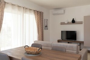 Comfort Apartment, 1 Bedroom, Balcony | Living area - Le Dimore by Wonderful Italy (Olbia)