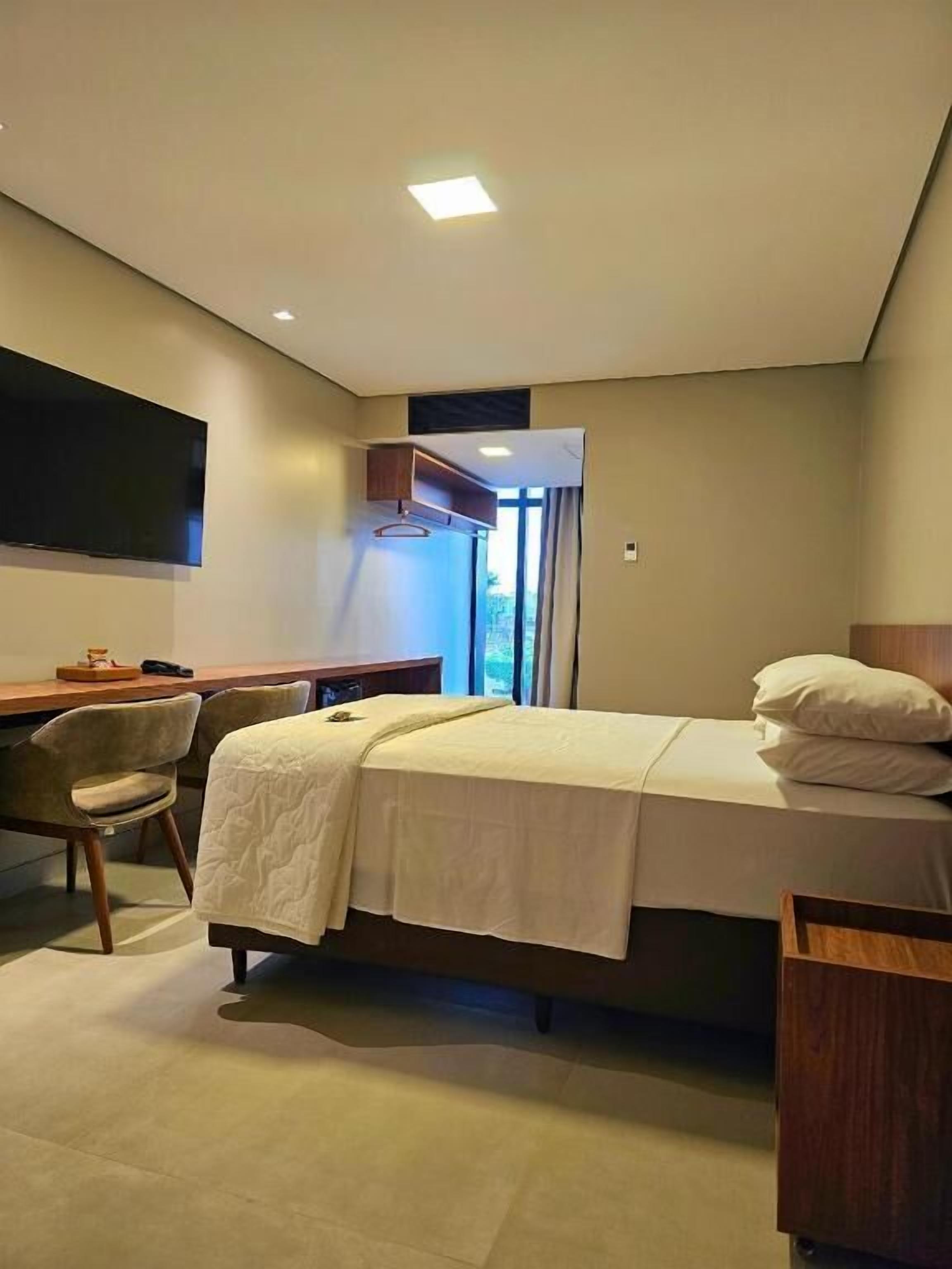 Deluxe Double Room, City View | Desk, laptop workspace, soundproofing, iron/ironing board