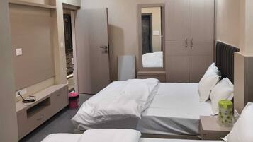 Family Room, Balcony, City View | Free WiFi