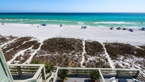 A beach view with a clear sky, sandy beach, and a path leading to the water. - Beach Front Townhome in Miramar Beach (Miramar Beach)