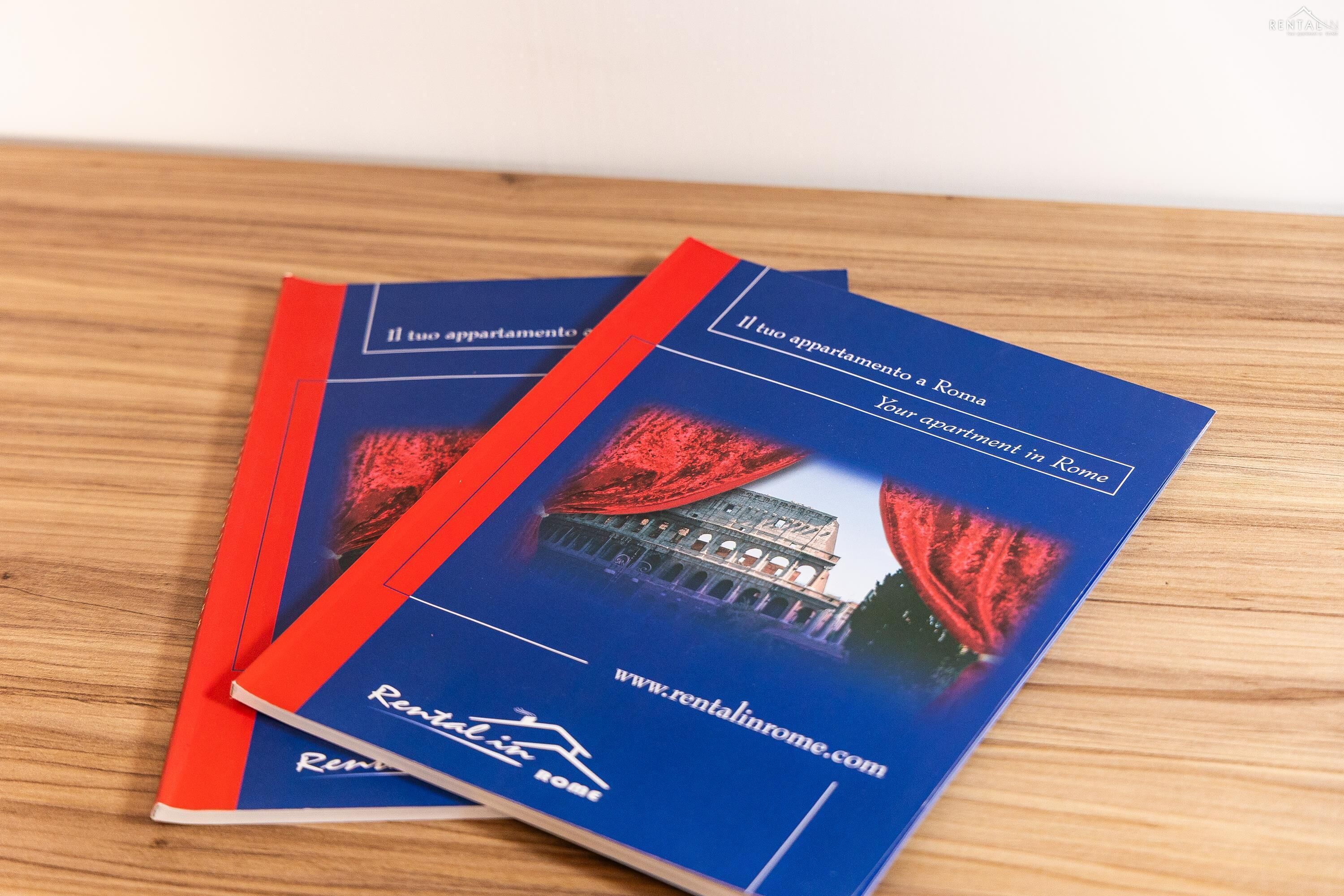 A brochure with a photo of the Colosseum and text in Italian.
