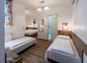 Quadruple Room | Hypo-allergenic bedding, in-room safe, desk, laptop workspace