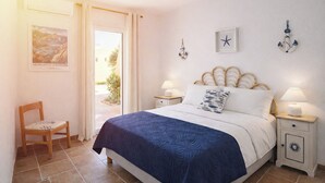 A bedroom with a bed, two bedside tables, a chair, a window, and decorative wall art. - Casa Audrey by Wonderful Italy (Santa Teresa di Gallura)