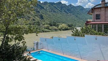 Seasonal outdoor pool, open 9:00 AM to 8:00 PM, free pool cabanas