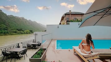 Seasonal outdoor pool, open 9:00 AM to 8:00 PM, free pool cabanas