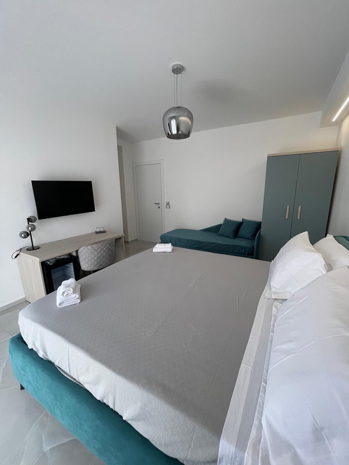 Comfort Triple Room, Balcony | In-room safe, desk, laptop workspace, blackout curtains