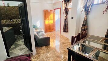 Double Room, Private Bathroom, City View | Living area