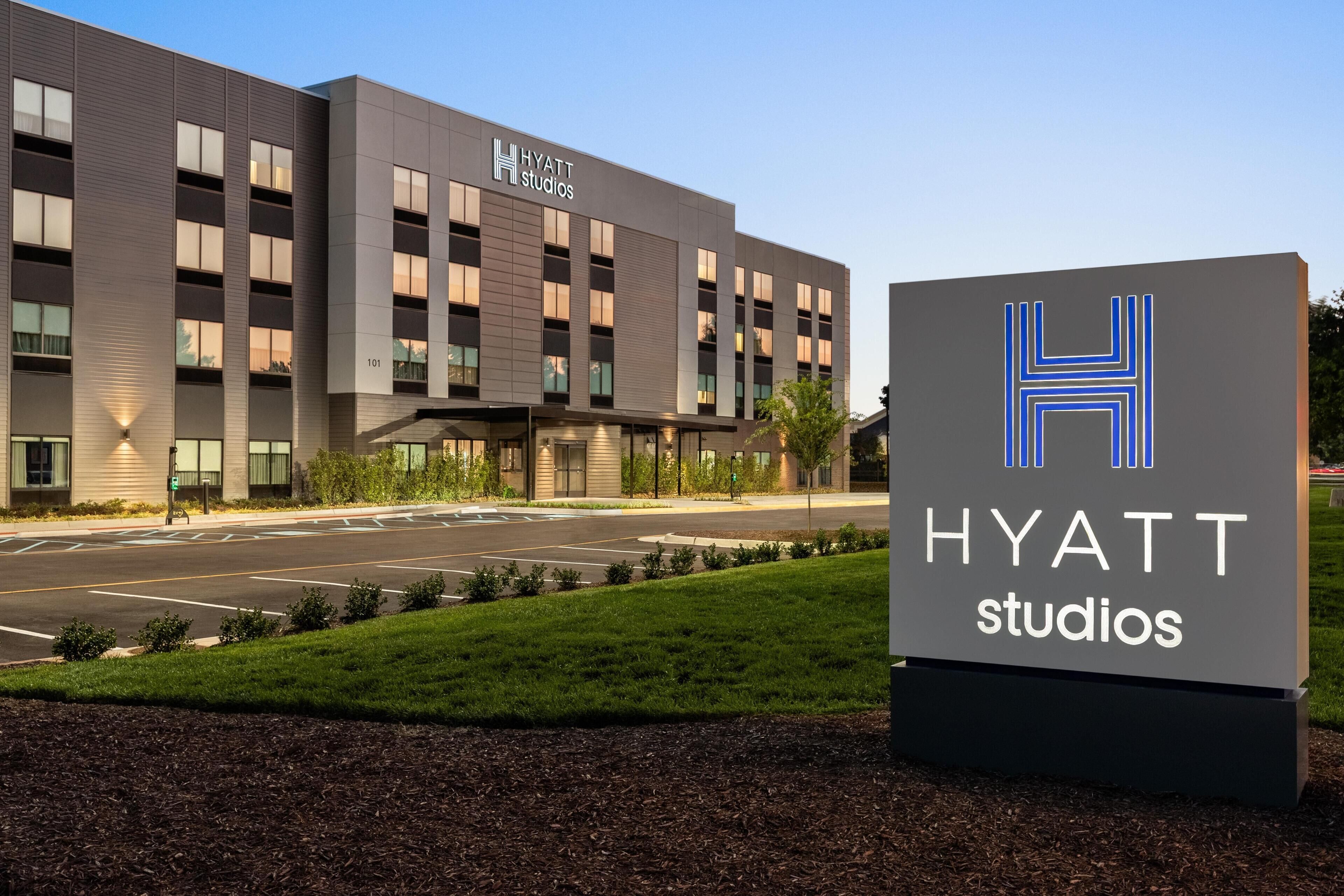 A modern building with a sign reading 'HYATT studios'.