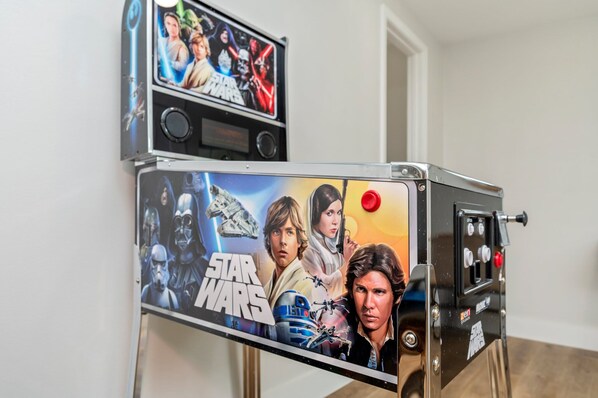 A refrigerator with Star Wars-themed artwork and a control panel. - Sleeps 14 • Outdoor Patio • Firepit • Game Room (Fort Walton Beach)