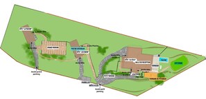 Una representació tridimensional d'un parc amb diverses comoditats, incloent una àrea de pàrquing espaiosa, una zona de pàrquing més petita, un escenari urbà i una sala de recepció.