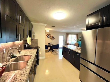 Fridge, microwave, oven, stovetop. Charming 3-bedroom bungalow in Sunrise w/AC and Patio. Family & Pet friendly!