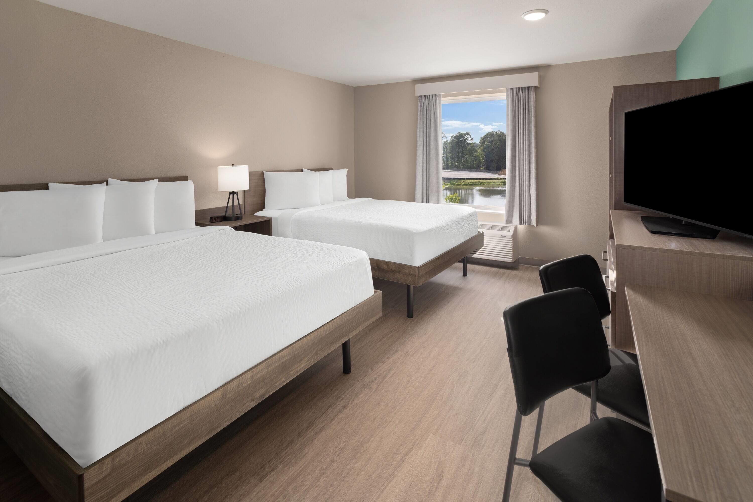 Suite, 2 Queen Beds, Non Smoking | Desk, laptop workspace, WiFi (free), bed sheets