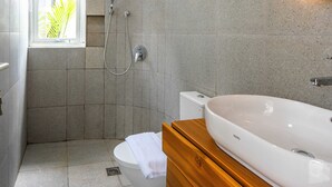 A bathroom with a shower, toilet, and sink. - New Rooftop Jacuzzi & Private Pool Villa near Canggu/Seminyak. (Bali)