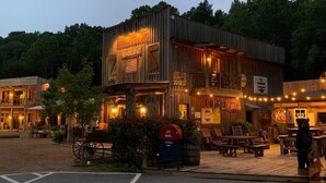 A rustic building with a sign for breakfast, a mailbox, and a Coca-Cola sign. - Prospector Pickwick Lake / Presidential Suite (Hardin County)