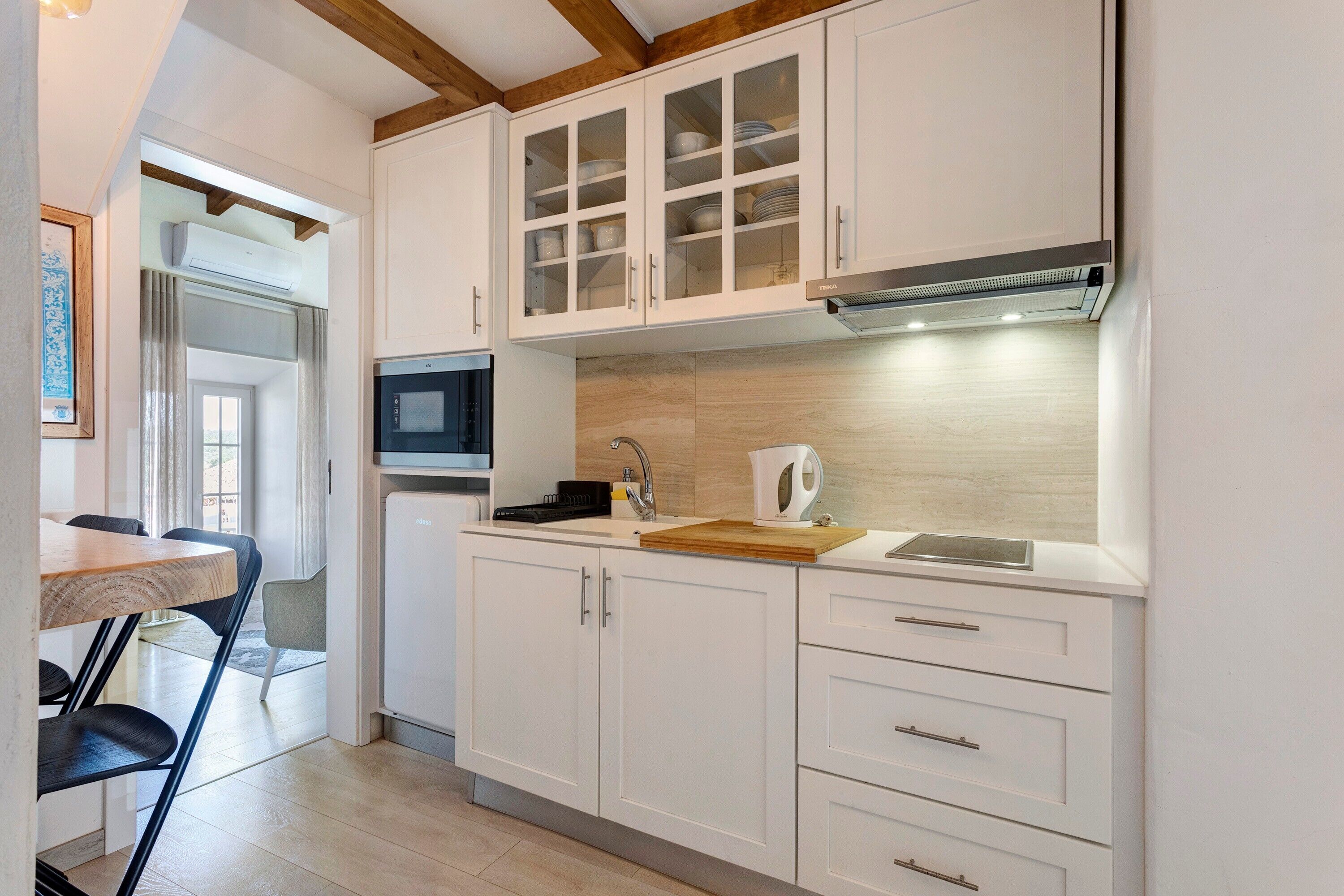 Fridge, microwave, stovetop, coffee/tea maker