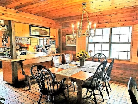 Dining. 4B/4B Log Cabin Guesthouse includes an Old Western Town, Saloon & Firepit!