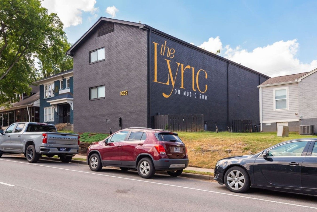 A building with a large sign reading 'the Lyric on Music Row.'
