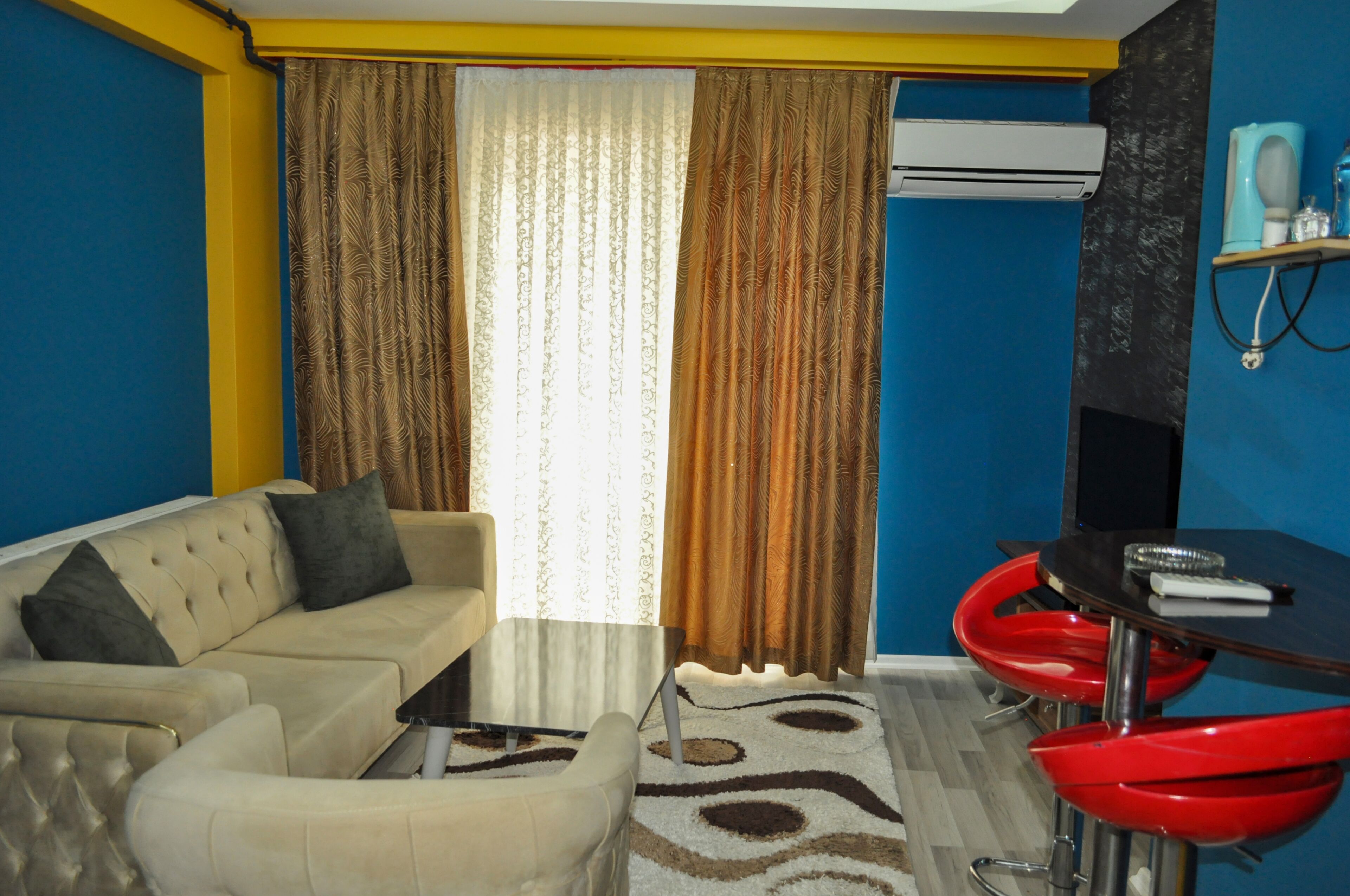 Deluxe Apartment, Balcony | Living area | 102-inch LCD TV with cable channels
