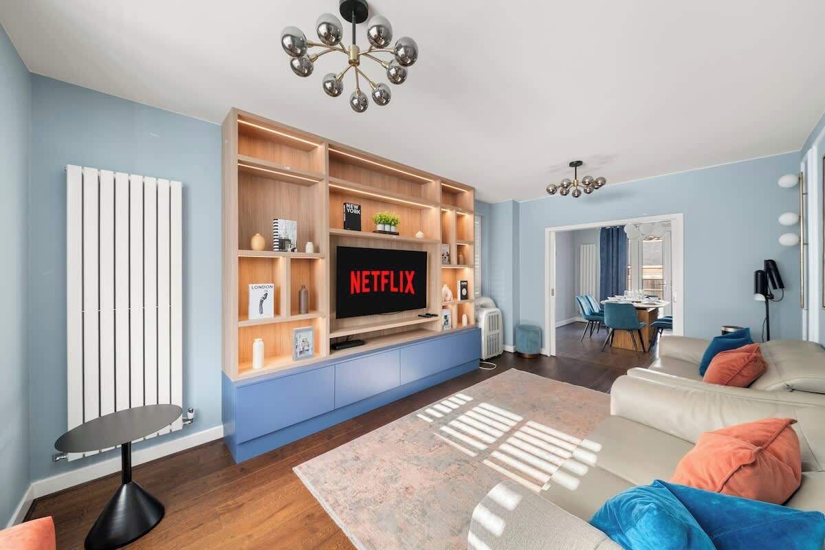 Bright living room with custom shelving and cozy modern seating