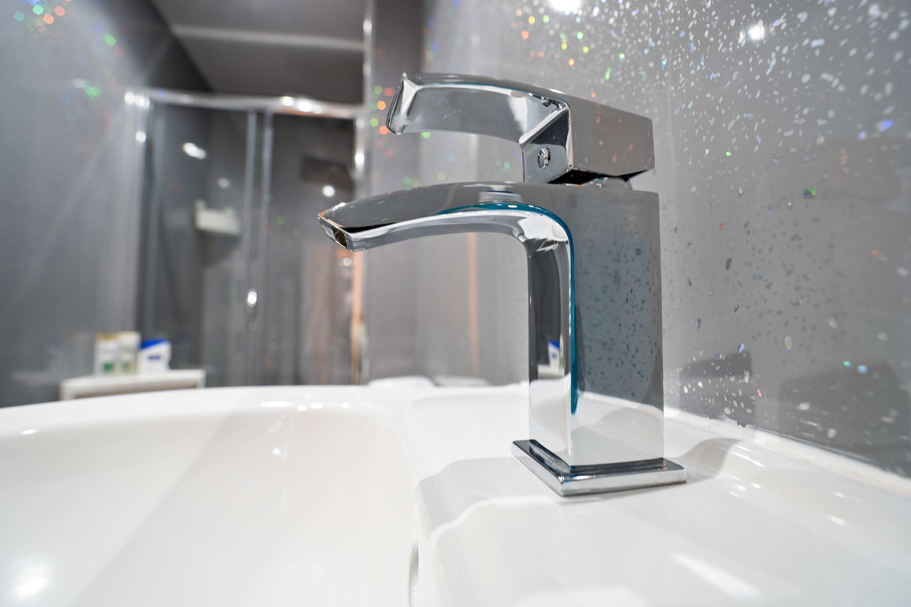 Shower, hair dryer, towels, shampoo