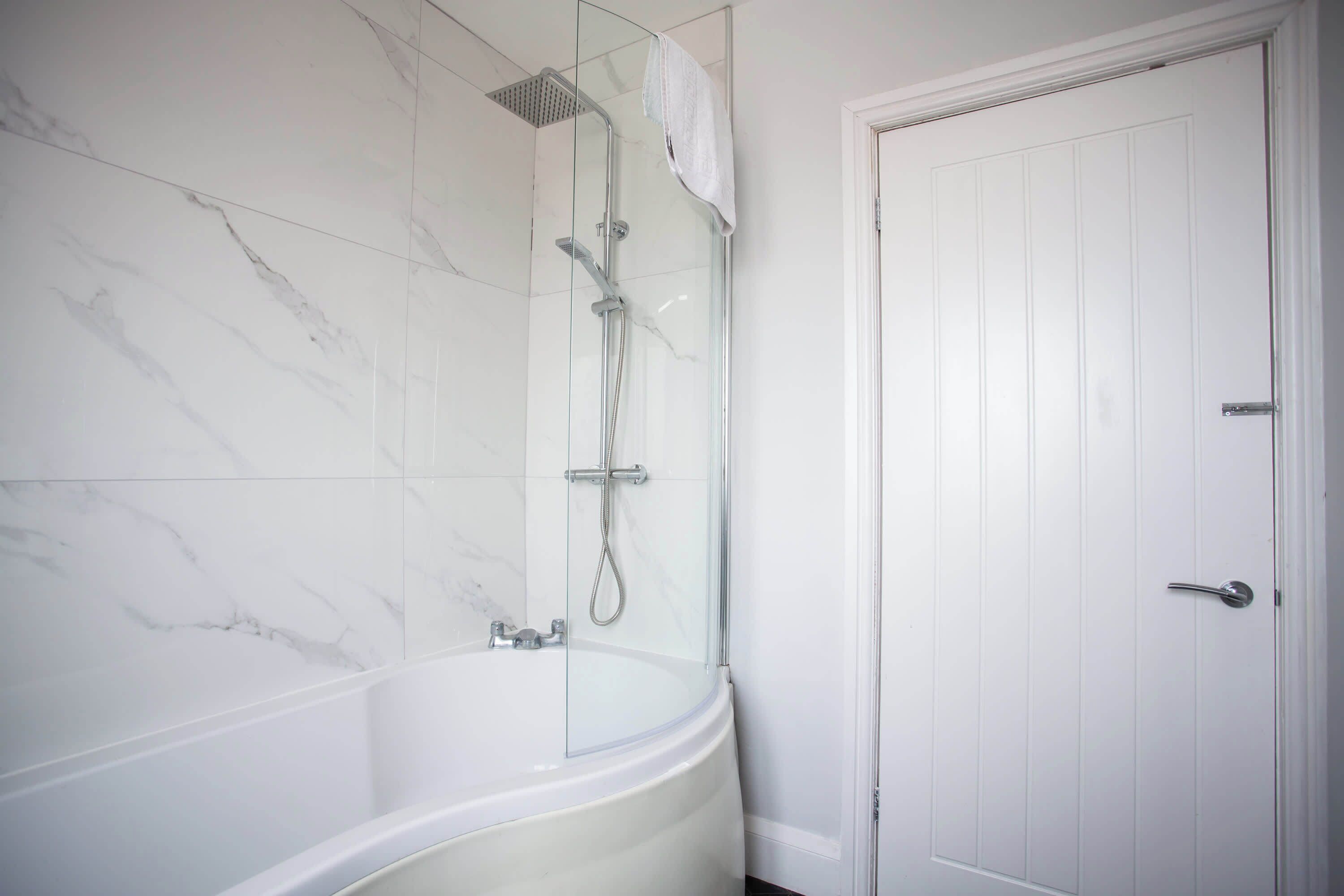 Shower, hair dryer, towels, shampoo