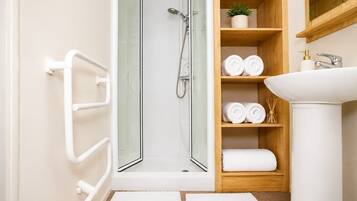 Shower, hair dryer, towels, shampoo