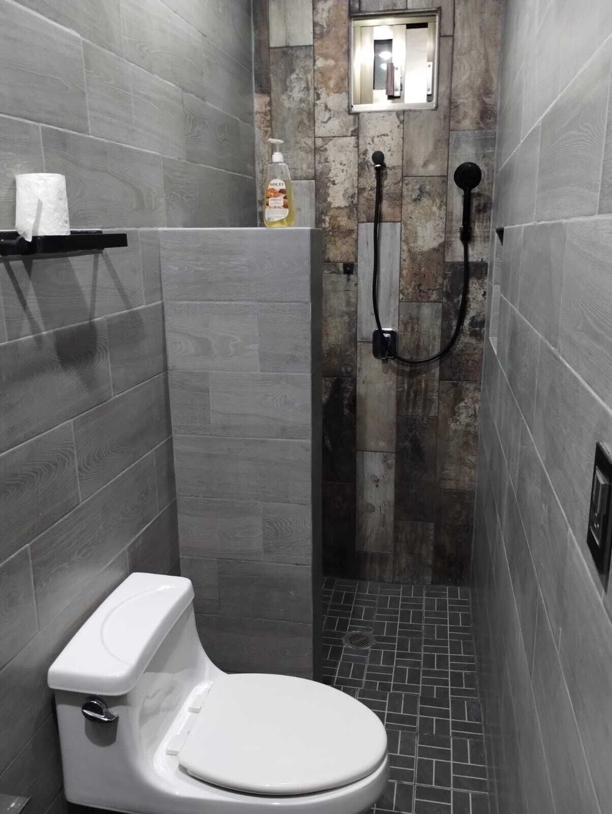 Shower, towels, soap, toilet paper