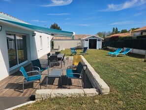 A patio with outdoor furniture, a covered seating area, and a small shed. - Longebeach - Three Bedroom House, Sleeps 6 (Longeville-sur-Mer)
