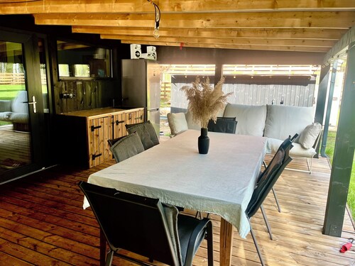 Fresh and new cabin house with large teracce under roof + hot tube.