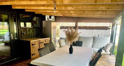 Fresh and new cabin house with large teracce under roof + hot tube.